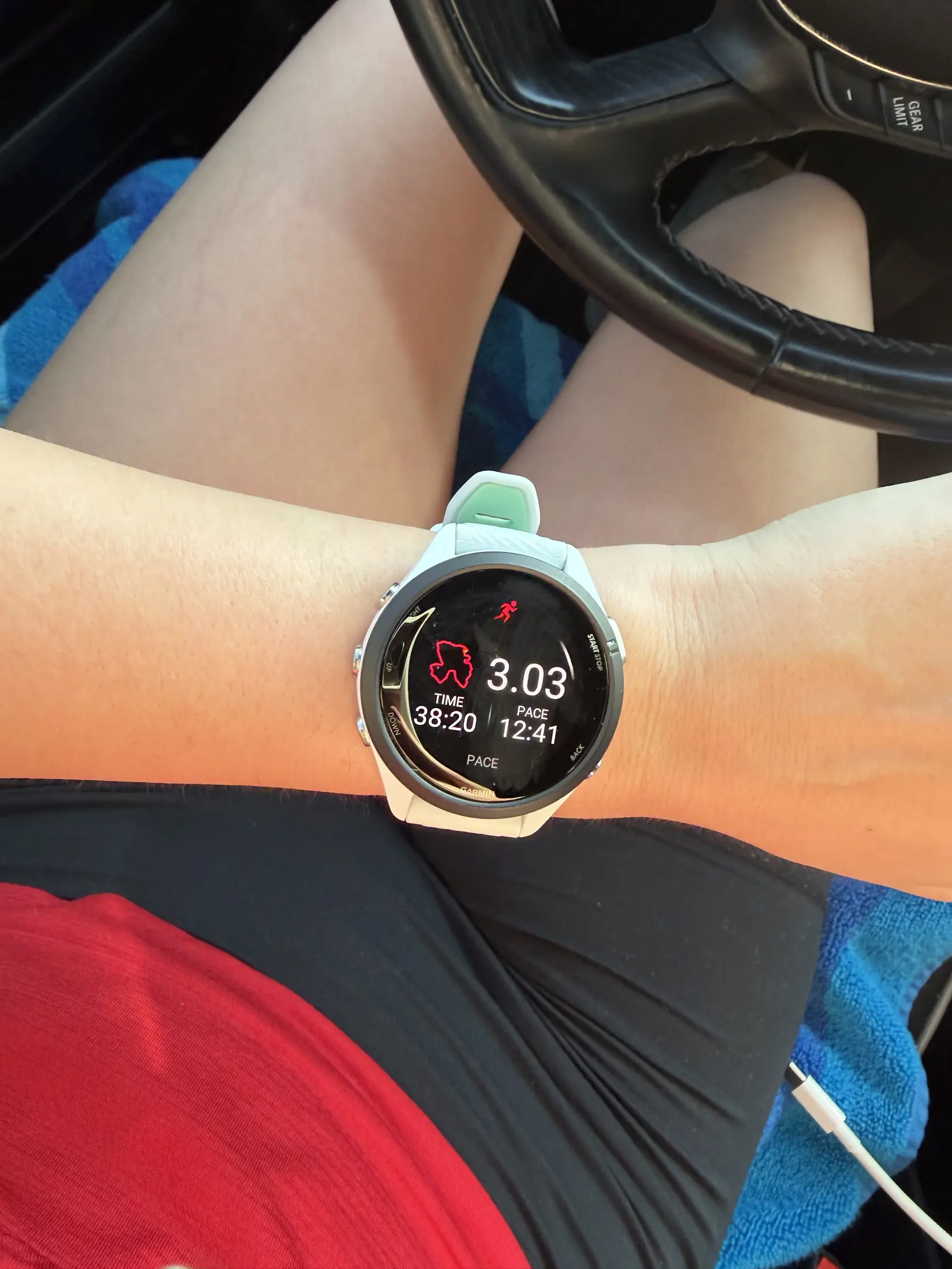 Garmin watch showing a completed three-mile run