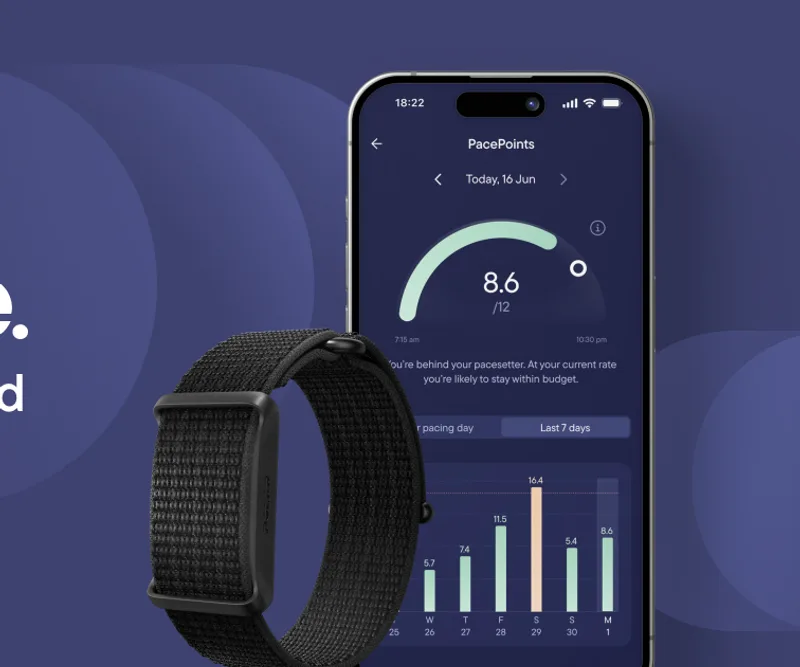 Visible armband alongside the Visible app showing pacing data